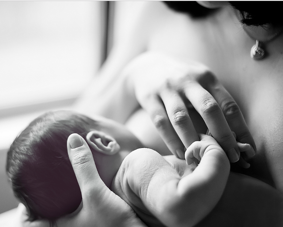 Mother breastfeeding her baby with skin-to-skin contact